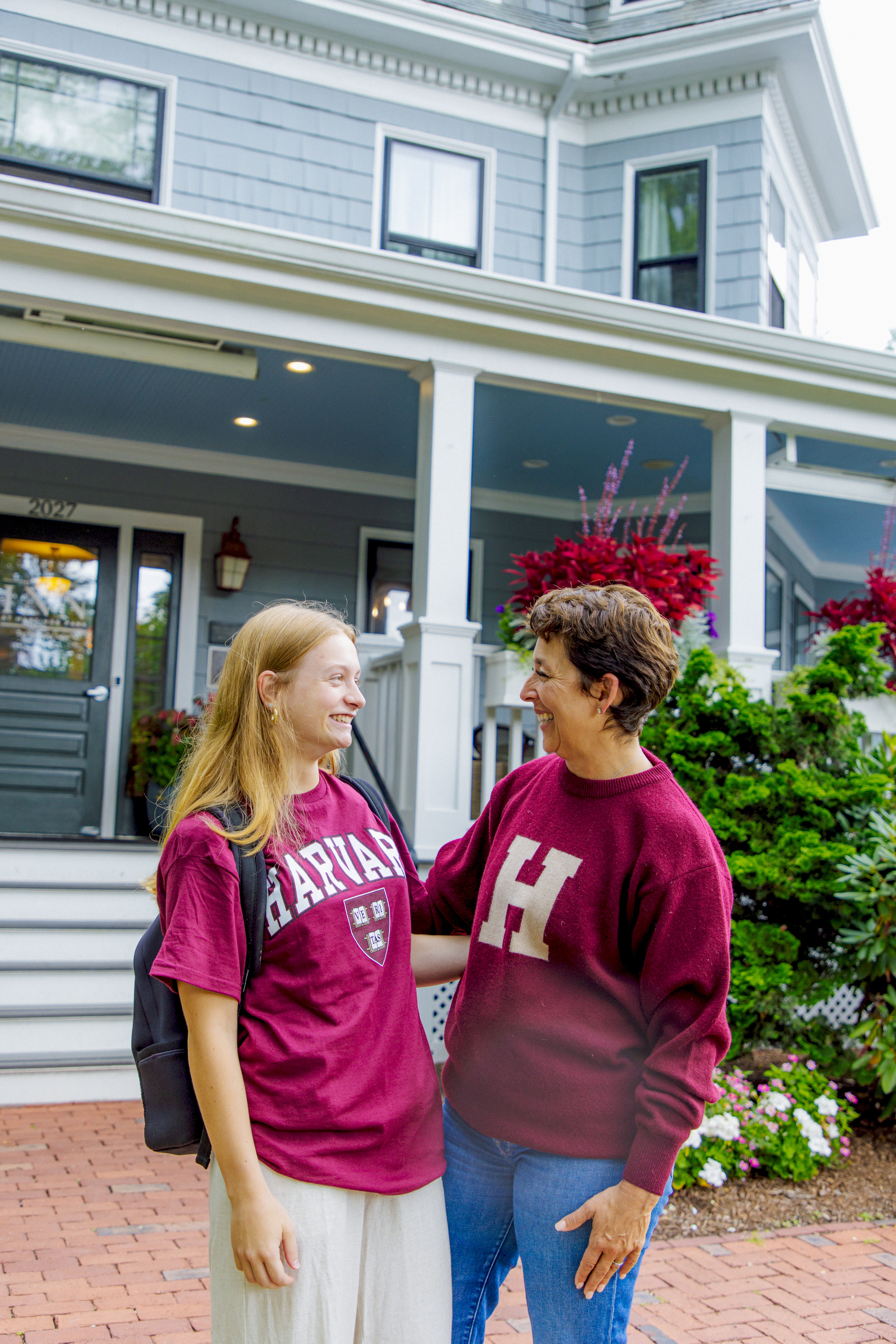 Mom and daughter with Harvard sweatshirts/ back to school