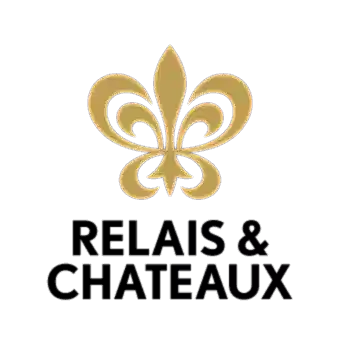 Gold fleur-de-lis symbol above bold black text reading RELAIS & CHATEAUX on a light gray background.